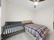 Bedroom with a bed, crib, carpeted floors, and a ceiling fan at 616 Long Lake Dr, Fuquay Varina, NC 27526