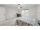 Comfortable bedroom featuring a ceiling fan, neutral paint, and a large window at 616 Long Lake Dr, Fuquay Varina, NC 27526