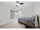 Cozy bedroom with a comfortable bed, carpeted floors, and a bright window view at 616 Long Lake Dr, Fuquay Varina, NC 27526