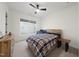 Bedroom with a bed, crib, carpeted floors, a ceiling fan, and a dresser at 616 Long Lake Dr, Fuquay Varina, NC 27526