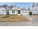 Charming home with a modern design, a two-car garage, and landscaped front yard at 616 Long Lake Dr, Fuquay Varina, NC 27526