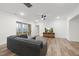 Comfortable living room features hardwood floors, natural light, and seamless access to a covered patio at 616 Long Lake Dr, Fuquay Varina, NC 27526
