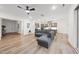 Bright, open-concept living space flows into kitchen with modern cabinets and stainless-steel appliances at 616 Long Lake Dr, Fuquay Varina, NC 27526