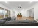 Inviting living room with fireplace views, hardwood floors, and access to an outdoor area at 616 Long Lake Dr, Fuquay Varina, NC 27526