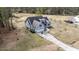 An overhead shot showcases a landscaped home with a long driveway and ample yard space at 64 Old Barn Way, Wendell, NC 27591