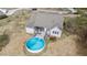 Aerial view of backyard with above-ground pool and deck, perfect for outdoor entertaining and relaxation at 64 Old Barn Way, Wendell, NC 27591