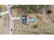 A bird's eye view captures the home with a backyard swimming pool and surrounding greenery at 64 Old Barn Way, Wendell, NC 27591