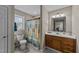 Bathroom featuring a shower/tub combo with a colorful shower curtain and a wood vanity at 64 Old Barn Way, Wendell, NC 27591