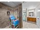 Accessible bathroom with a roll-in shower, tiled walls, and a nearby vanity at 64 Old Barn Way, Wendell, NC 27591