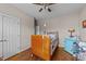 Bedroom featuring hardwood floors, ample natural light, and a minimalist aesthetic at 64 Old Barn Way, Wendell, NC 27591
