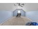 Large carpeted bonus room with vaulted ceilings and a ceiling fan, perfect for a media or play area at 64 Old Barn Way, Wendell, NC 27591