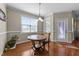 Cozy breakfast nook with sunlit windows and a stylish round table seating area at 64 Old Barn Way, Wendell, NC 27591