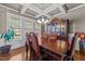 Elegant dining room featuring coffered ceilings, hardwood floors and a large china cabinet at 64 Old Barn Way, Wendell, NC 27591