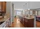 Well-lit kitchen showcasing granite countertops, modern appliances, and abundant cabinet space at 64 Old Barn Way, Wendell, NC 27591