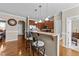 Kitchen with hardwood floors, granite countertops, stainless steel appliances, and breakfast bar seating at 64 Old Barn Way, Wendell, NC 27591