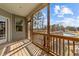 Screened-in porch with wood flooring offering views of the surrounding yard and pool at 64 Old Barn Way, Wendell, NC 27591