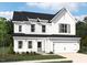 Charming two-story home with white siding, black roof, manicured lawn, and an attached two-car garage at 700 Compeer Way # 29, Rolesville, NC 27571