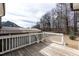 Open-air deck and backyard with mature trees on clear day at 76 Freewill Pl, Raleigh, NC 27603
