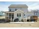 Spacious backyard with hot tub, screen porch, and well-maintained lawn at 76 Freewill Pl, Raleigh, NC 27603