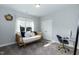 Guest bedroom with a daybed and a desk with modern finishes at 76 Freewill Pl, Raleigh, NC 27603