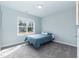 Cozy bedroom with large window providing natural light at 76 Freewill Pl, Raleigh, NC 27603