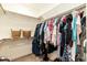 Walk-in closet with ample hanging space and built-in shelving at 76 Freewill Pl, Raleigh, NC 27603