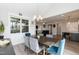 Cozy dining room with a table, chairs, modern lighting, and an open view at 76 Freewill Pl, Raleigh, NC 27603
