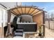 Inviting hot tub under a canopy in private backyard oasis at 76 Freewill Pl, Raleigh, NC 27603