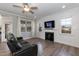 Cozy living room with a fireplace, plush couch, and ample natural light at 76 Freewill Pl, Raleigh, NC 27603