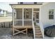 Relaxing screened porch features fan and steps to backyard at 76 Freewill Pl, Raleigh, NC 27603