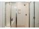 Modern shower stall with a glass door and white subway tile at 76 Freewill Pl, Raleigh, NC 27603