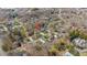 A neighborhood aerial view showing the home's location among tree-lined streets and well-maintained properties at 810 Warwick Ct, Burlington, NC 27215