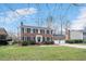 Attractive two-story brick home with black shutters and a spacious two-car garage at 810 Warwick Ct, Burlington, NC 27215