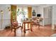 Bright living area featuring a table with seating, and a separate desk area by the window at 810 Warwick Ct, Burlington, NC 27215