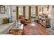 Inviting living room with a comfortable couch, leather chair, and stylish rug at 810 Warwick Ct, Burlington, NC 27215