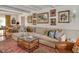 Comfortable living room featuring a large sectional sofa, decorative pillows, and a patterned rug at 810 Warwick Ct, Burlington, NC 27215