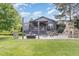 Spacious backyard with a stone patio, outdoor fireplace, and room for entertaining and recreation at 8324 Humie Olive Rd, Apex, NC 27502