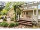 Inviting backyard patio with outdoor seating, a pergola, and a lush garden view at 8324 Humie Olive Rd, Apex, NC 27502