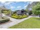 Beautifully landscaped backyard with stone pathways, gardens, and outdoor seating areas at 8324 Humie Olive Rd, Apex, NC 27502
