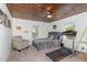 Bedroom with a wood ceiling, a gray bed with decorative pillows, a ceiling fan, and a treadmill at 8324 Humie Olive Rd, Apex, NC 27502