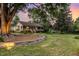 Charming single-story home with a welcoming porch, mature trees, and beautifully landscaped front yard at 8324 Humie Olive Rd, Apex, NC 27502