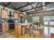 Well-appointed kitchen with stainless appliances, an island, and custom wood cabinets at 8324 Humie Olive Rd, Apex, NC 27502