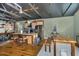 Open kitchen with stainless steel appliances, a center island with seating, and custom wood cabinetry at 8324 Humie Olive Rd, Apex, NC 27502