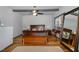 Serene main bedroom features a wooden bed frame, storage bench, and neutral decor at 8324 Humie Olive Rd, Apex, NC 27502