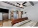 Main bedroom with TV, closet, ceiling fan and neutral tones at 8324 Humie Olive Rd, Apex, NC 27502