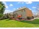 Expansive backyard with a brick patio, a screened porch and well-maintained lawn at 8912 Riverview Park Dr, Raleigh, NC 27613