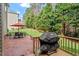 Patio with a grill and patio dining set at 8912 Riverview Park Dr, Raleigh, NC 27613