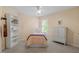 Bedroom with a bed, a bookcase, a chest of drawers, and a window at 8912 Riverview Park Dr, Raleigh, NC 27613