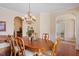 Elegant dining room with hardwood floors and chandelier, perfect for hosting gatherings and special occasions at 8912 Riverview Park Dr, Raleigh, NC 27613