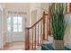 Bright foyer features hardwood floors, staircase, and detailed front door at 8912 Riverview Park Dr, Raleigh, NC 27613